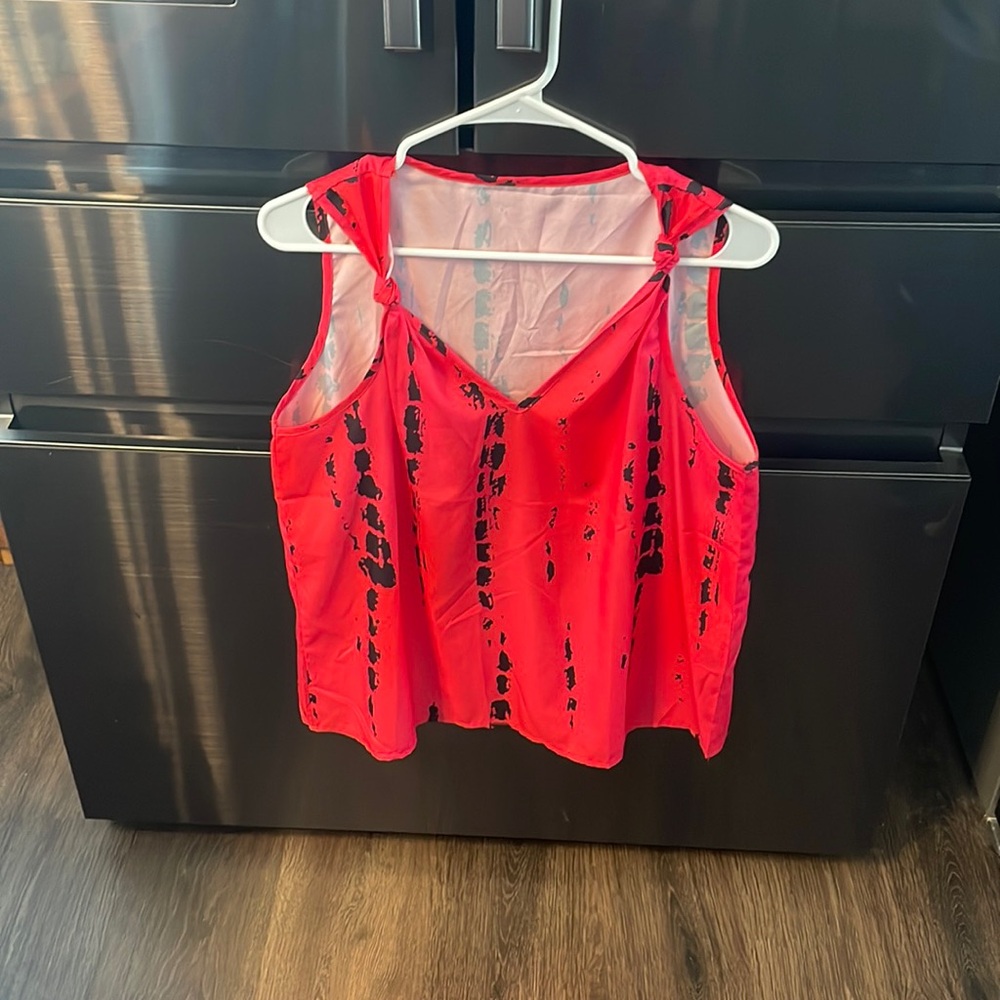 Pink and black tank top. Never worn.